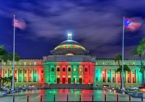 Puerto Rico Capitol and Castillo de San Cristobal, San Juan, Puerto Rico. Castillo de San Cristobal is designated as UNESCO World Heritage Site since 1983. photo