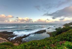 Playa Pena in San Juan, Puerto Rico at sunset. photo