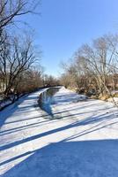 Snow covered Otter Creek River in Vermont from the Hammond Covered Bridge. photo