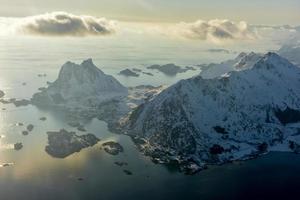 An aerial view of the snow covered mountains of the Lofoten Islands, Norway in the winter. photo