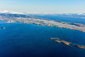 An aerial view of the snow covered mountains of the Lofoten Islands, Norway in the winter. photo