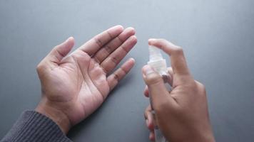 close up of young man hand using hand sanitizer spray video