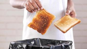 throwing bread in a garbage bin video