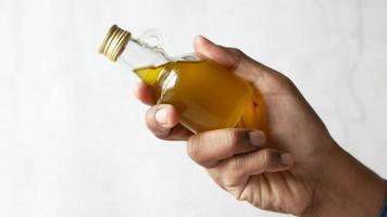 hand holding a bottle of olive oil video