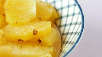 slice of many pineapples on table top view video