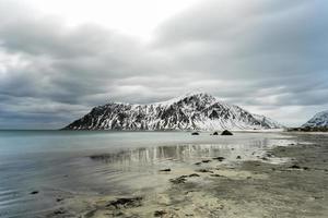 Skagsanden Beach in the Lofoten Islands, Norway in the winter on a cloudy day. photo