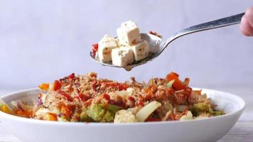 Close up of greek salad in a bowl on table video