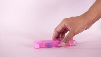 close up of of medical pills in a pill color pill box video