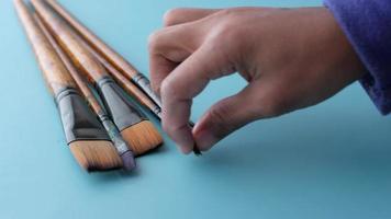 hand pick many art brush on color background video