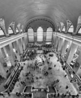 New York City - December 28, 2015 -  Black and white photo of the Beaux-Arts style hall with people in Grand Central Terminal in New York City during Christmas.