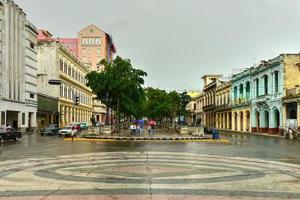 Havana, Cuba - January 7, 2016 -  People walking along the wide boulevard Paseo del Pradoin Havana, Cuba. photo