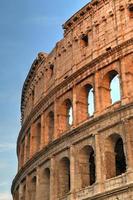 Ancient Roman Colosseum at sunset in Rome, Italy. photo