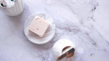 Homemade natural soap bar on white background video
