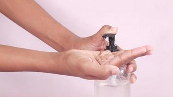 close up of young man hand using hand sanitizer spray video