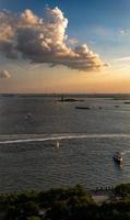 Aerial view of the Statue of Liberty at sunset from Lower Manhattan, New York City photo