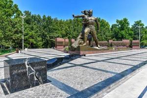 Tashkent, Uzbekistan - July 8, 2019 -  Monument of Courage or Earthquake Memorial complex dedicated to rectification of the consequences of a devastating Tashkent earthquake in 1966. photo