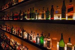 Buenos Aires, Argentina - May 22, 2007 -  Several types of bottled alcohol and liquor are displayed on some shelves in a pub. photo