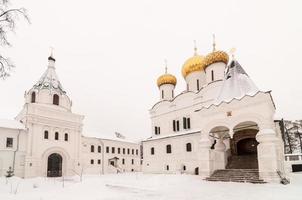 The Ipatiev Monastery, a male monastery, situated on the bank of the Kostroma River just opposite the city of Kostroma, Russia in the winter. photo