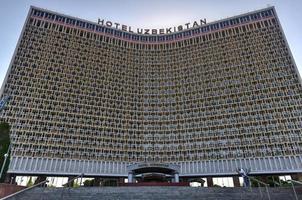 Tashkent, Uzbekistan - July 8, 2019 -  Hotel Uzbekistan built in the Soviet style in central Tashkent. photo