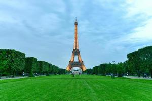 The iconic Eiffel Tower on a drizzly evening from the Champ de Mars in Paris, France, 2022 photo