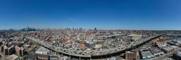 Brooklyn, New York - Apr 8, 2021 -  Panoramic view of the Gowanus Expressway in Brooklyn, New York with the Manhattan skyline in the background. photo