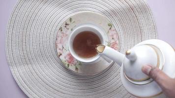 pouring tea from a tea ceremony top down video