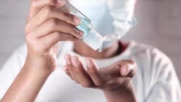 detail shot of young man hand using hand sanitizer spray video