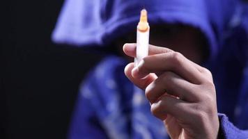drug addiction concept with hand holding syringe isolated on black video