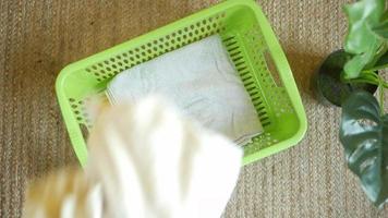 Top view of Clothes in basket on floor . video