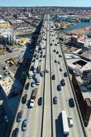Brooklyn, New York - Apr 8, 2021 -  Panoramic view of the Gowanus Expressway in Brooklyn, New York with the Manhattan skyline in the background. photo