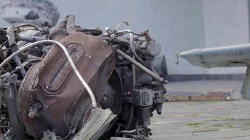 Detail of a burned out helicopter. Remains of a destroyed Russian Air Force combat helicopter Hind Crocodile. Engine rotor, blades, tail, wreckage of a crashed combat helicopter close-up. video