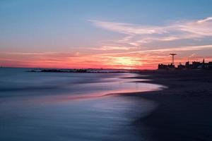 Sunset on Coney Island Beach in Brooklyn, New York. photo