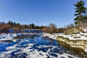 Hog's Back falls located on the Rideau River in Hog's Back park in Ottawa, Ontario Canada frozen over in winter. photo