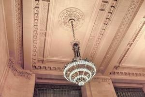 New York City - December 28, 2015 -  Beaux-Arts style waiting hall decorated with chandeliers in Grand Central Terminal in New York City. photo