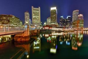 Boston Harbor in Massachusetts, USA with its mix of modern and historic architecture at night. photo