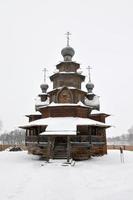 The Wooden Church of the Resurrection of Christ in the Museum of Wooden Architecture and Peasants' Life on a Winter Day in Suzdal, Russia. photo