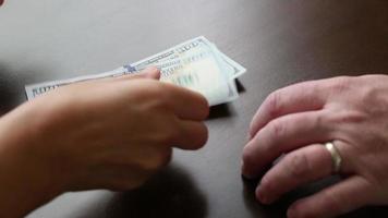 Stacks of One Hundred Dollar Bills Dropping On Table video