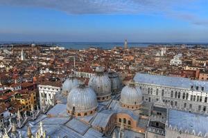 Aerial view of Saint Marks Square in Venice Italy. It is the principal public square of Venice, Italy, where it is generally known just as la Piazza. photo