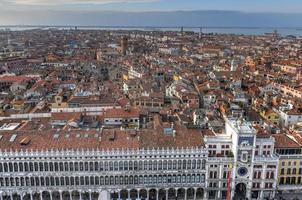 Aerial view of Saint Marks Square in Venice Italy. It is the principal public square of Venice, Italy, where it is generally known just as la Piazza. photo