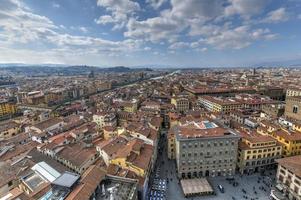 Aerial view of Florence and Palazzo Vecchio in Piazza della Signoria in Florence, Italy. Architecture and landmark of Florence. photo