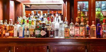 New York - January 24, 2016 -  Classic old wooden bar with various drinks and tonics. photo