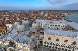 Aerial view of Saint Marks Square in Venice Italy. It is the principal public square of Venice, Italy, where it is generally known just as la Piazza. photo