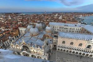 Aerial view of Saint Mark's Square in Venice Italy. It is the principal public square of Venice, Italy, where it is generally known just as la Piazza. photo
