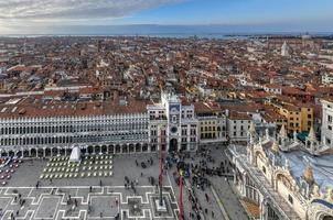 Aerial view of Saint Marks Square in Venice Italy. It is the principal public square of Venice, Italy, where it is generally known just as la Piazza. photo