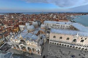 Aerial view of Saint Mark's Square in Venice Italy. It is the principal public square of Venice, Italy, where it is generally known just as la Piazza. photo