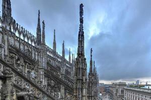 Milan Cathedral, Duomo di Milano, one of the largest churches in the world, on Piazza Duomo square in the Milan city center in Italy. photo