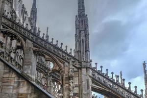 Milan Cathedral, Duomo di Milano, one of the largest churches in the world, on Piazza Duomo square in the Milan city center in Italy. photo