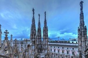 Milan Cathedral, Duomo di Milano, one of the largest churches in the world, on Piazza Duomo square in the Milan city center in Italy. photo