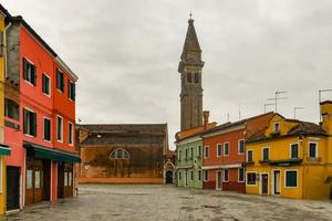 The tilted belfry of the Church of San Martino on the island of Burano is a 16th-century Roman Catholic church in Venice, Italy. photo