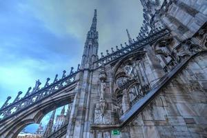 Milan Cathedral, Duomo di Milano, one of the largest churches in the world, on Piazza Duomo square in the Milan city center in Italy. photo